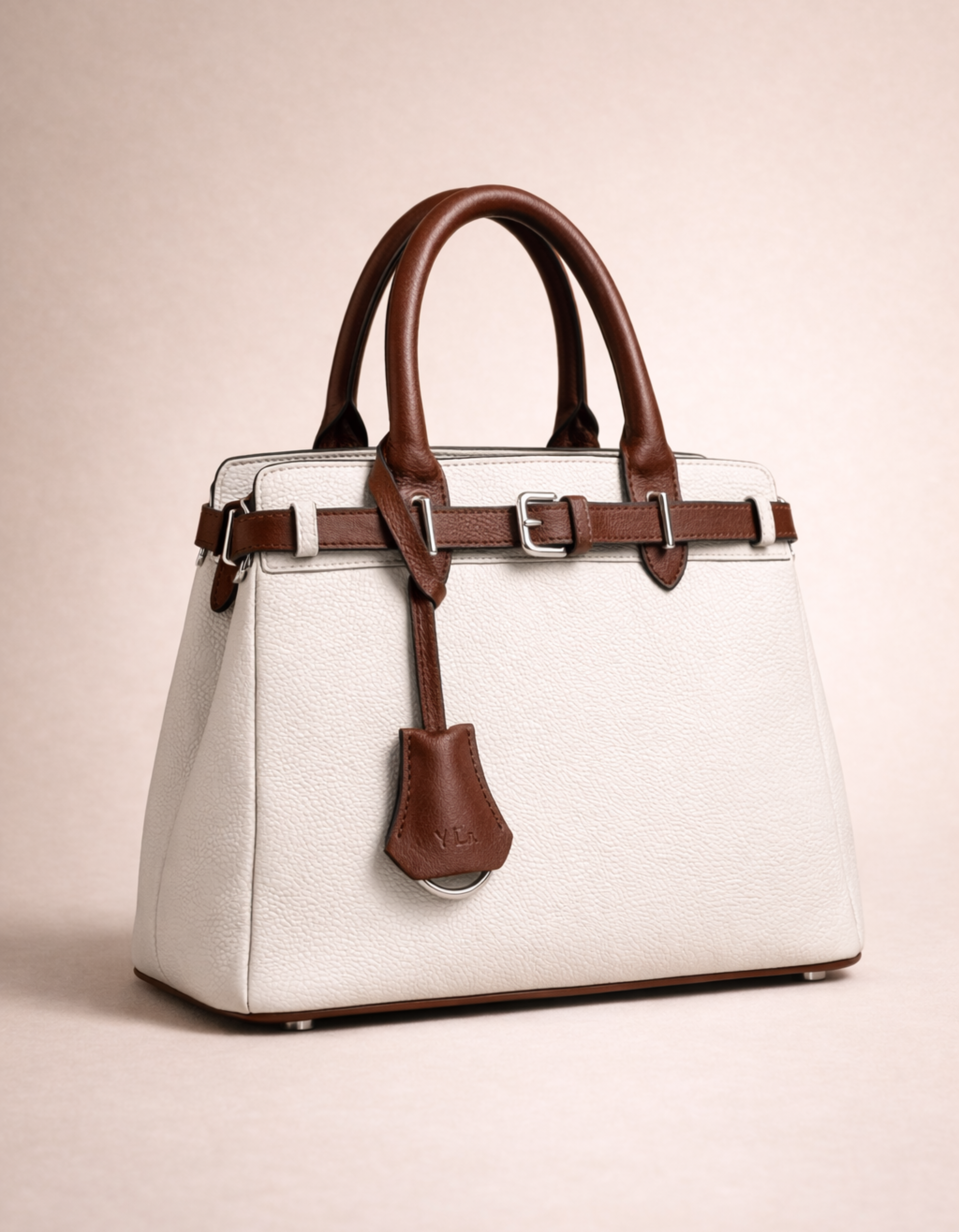 white and brown handbag