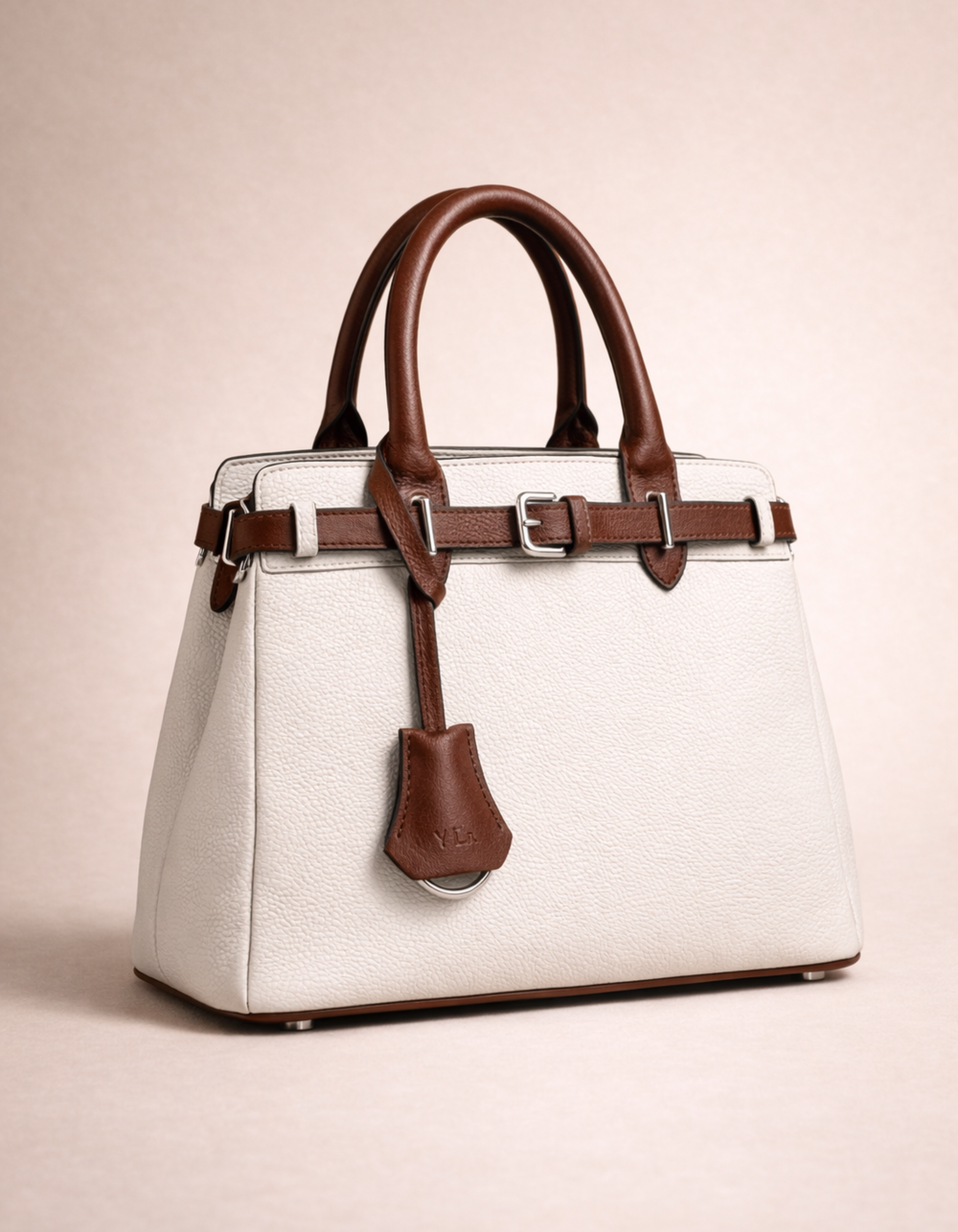 white and brown handbag