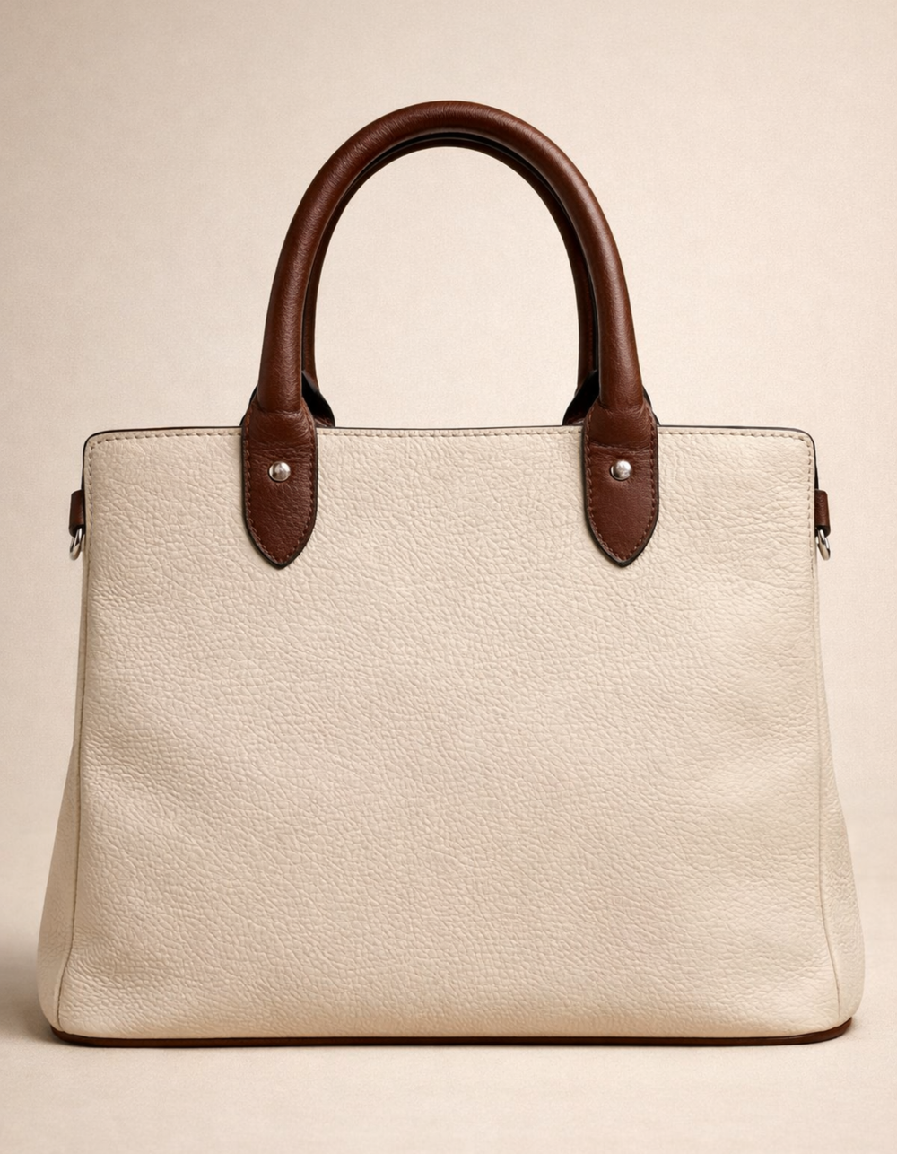 white and brown handbag