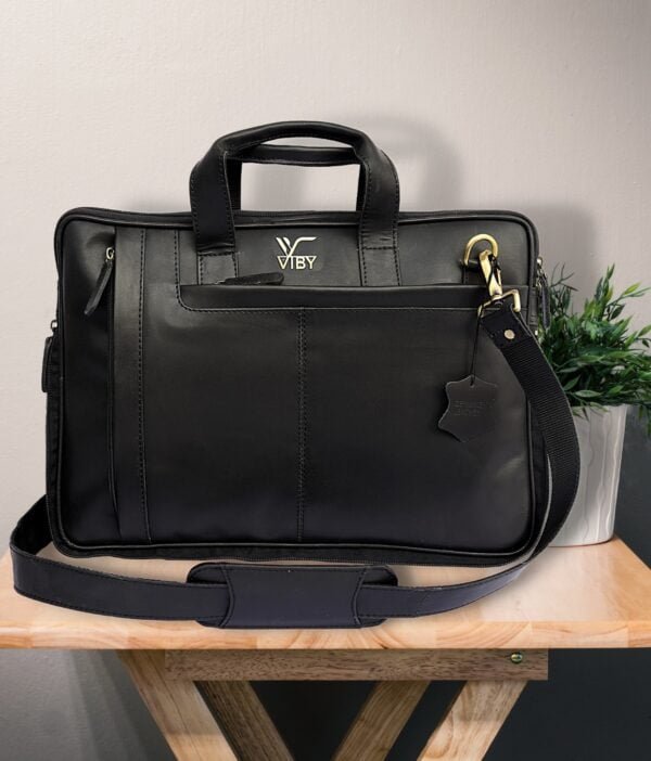 Back view of black leather laptop bag.