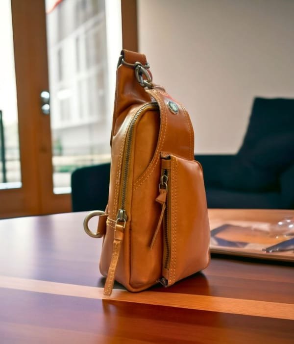 Side view of the Hudson Sling Bag, showing its compact and ergonomic design