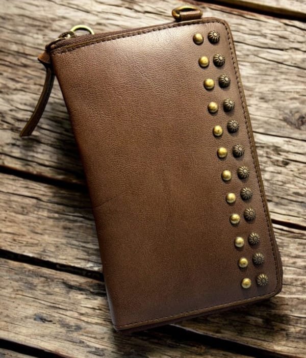 Tan genuine leather telephone clutch for women with front rivet design and adjustable sling handle